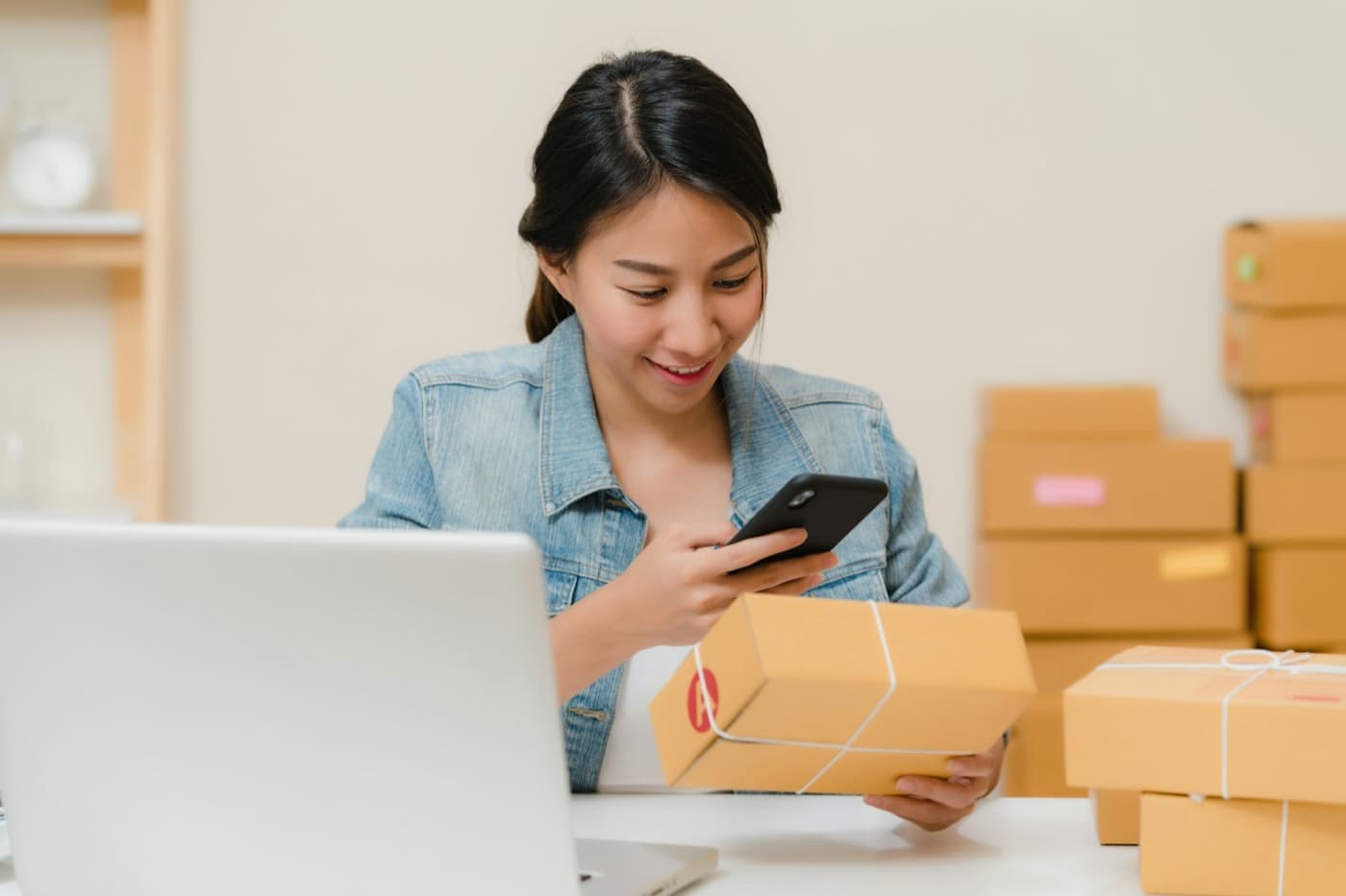Designer building an online store on a laptop