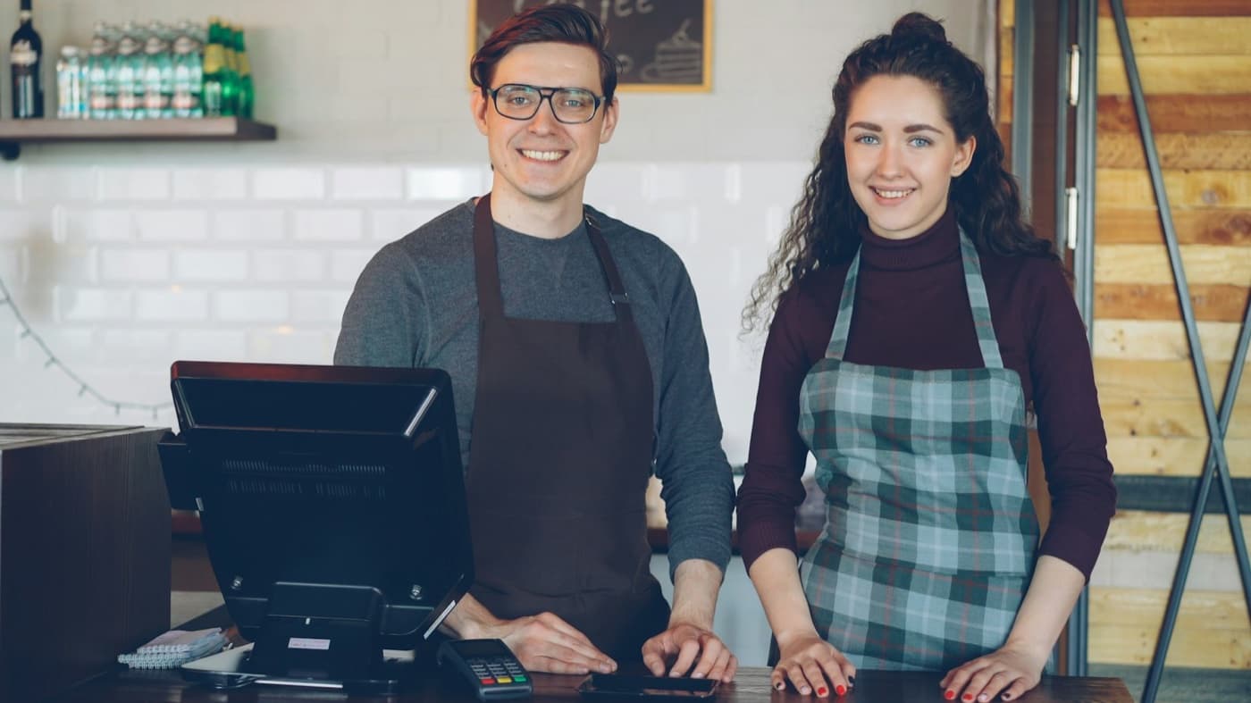 Restaurant staff serving guests