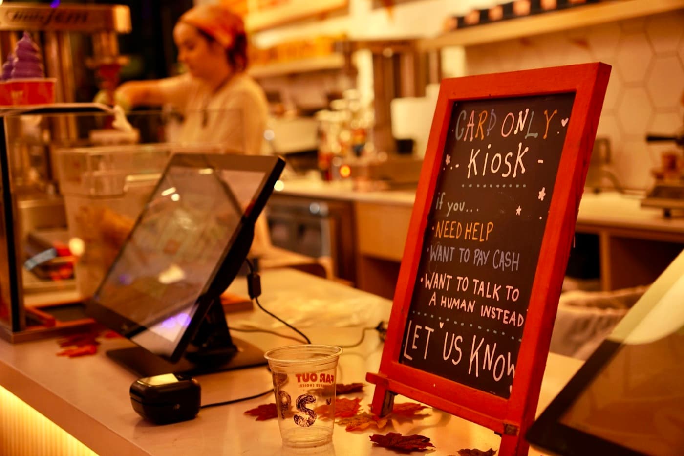 Customer ordering from a restaurant kiosk